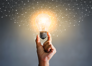 hand holding lightbulb